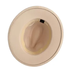 Interior detail view of a classic beige felt fedora hat showing inner material label.