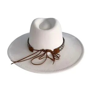White fedora cowboy hat with brown suede band and leather tassels, retro peach top design.