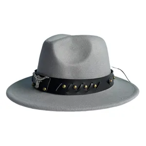 Close-up of grey fedora hat with black leather band, metal bull skull and rivet detail.
