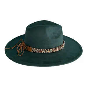 Close-up detail of the dark green suede fedora hat with ethnic woven band and leather tassels.