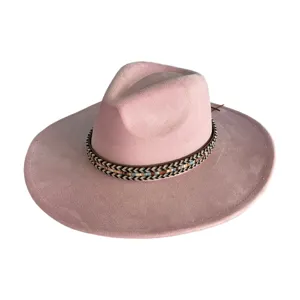 Close-up detail of the pink faux suede fedora hat, highlighting the woven tribal band.