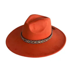 Close-up detail of the vintage wide-brim suede fedora hat with woven boho decorative band.