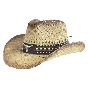Close-up of Western straw cowboy hat, breathable woven texture with metal bull skull decor.