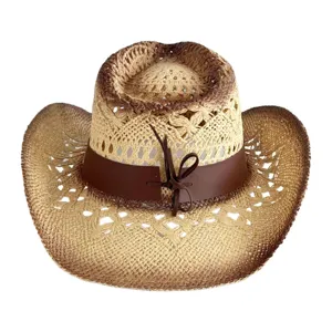 Detailed view of straw western cowboy hat with brown hollow-out design and leather band.