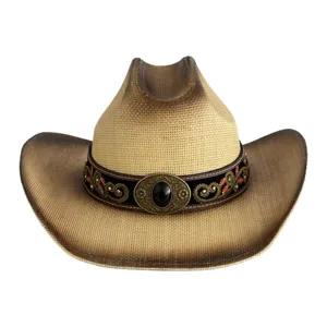 Detailed view of vintage straw cowboy hat with exquisite embroidered hatband and gemstone buckle.