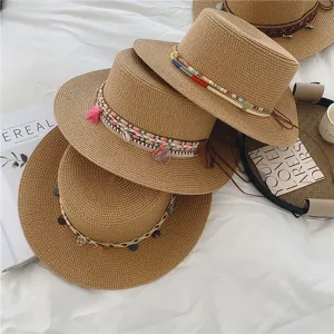 Ethnic style straw hat detail, summer beach sun protection flat top fedora with colorful bands.