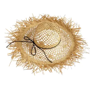Wide brim raffia straw hat with frayed raw edge and black ribbon bow for summer beach vacation