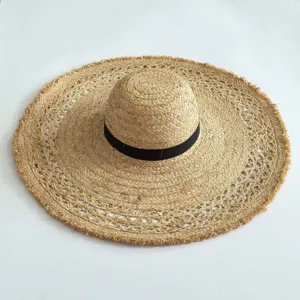 Wide brim frayed raffia sun hat for women, perfect for summer beach and outdoor vacation.