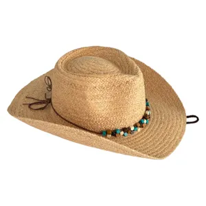 Gedetailleerd uitzicht van de strooien cowboyhoed met een kraaldecoratieband en zijkoorden.