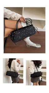 Black star print baguette shoulder bag detail showing stylish star pattern and slim straps.