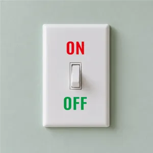 Close-up detail of a white wall switch plate with printed ON and OFF text for home decor.