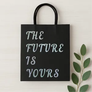 Black paper gift bag with holographic glitter text, elegant design for party gift packaging.