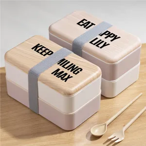 Fiambrera bento de doble capa con tapa efecto madera, correa y juego de cubiertos incluido.