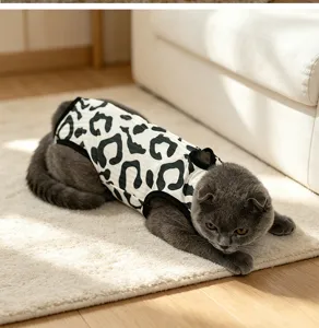 Detail shot of soft black and white leopard print pet recovery suit for cats and small animals.