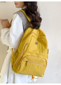 Sac a dos de voyage jaune decontracte grande capacite leger pour homme et femme quotidien.