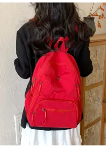 Sac à dos rouge décontracté pour hommes et femmes, grand cartable pour voyage quotidien.
