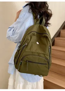 Sac à dos en nylon décontracté avec plusieurs poches zippées, grande capacité pour les voyages.