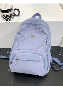 Sac à dos de voyage bleu clair décontracté avec poches, sac d'école quotidien durable pour unisexe.