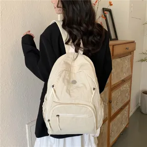 Sac à dos en nylon minimaliste et décontracté pour les voyages, léger et grande capacité.