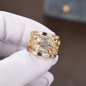 Wide openwork leaf ring with dual-tone cubic zirconia for elegant women fashion jewelry.