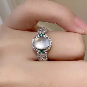 Detailed close-up of retro court style oval cabochon ring with sparkling rhinestone accents.