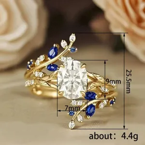 Close-up detail of creative leaf ring, gold-plated copper, cubic zirconia and blue stones.