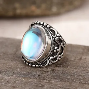 Detailed close-up shot of the vintage silver embossed ring featuring an iridescent stone.