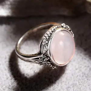 Vintage retro silver floral ring with pink synthetic moonstone for women fashion jewelry detail.