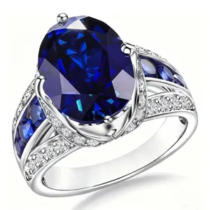 Primer plano detallado del elegante anillo de zafiro azul ovalado con un tallado exquisito.
