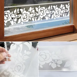 White floral window sticker detail showing translucent rose pattern and easy peeling texture.