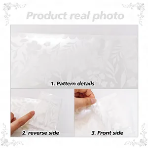 White floral lace waistline sticker detail showing embossed pattern and peeling backing layer.