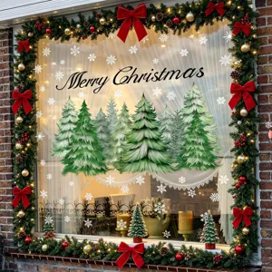 Close-up detail of Christmas window stickers with pine trees, snowflakes and festive text.