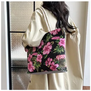 Fashionable floral canvas tote bag for women, large capacity shoulder bag for daily use.
