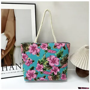 Floral canvas tote bag with sturdy rope handles, stylish tropical hibiscus print shoulder bag.