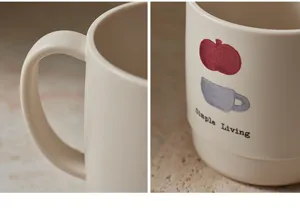 Detailed close-up view of beige toothbrush mug featuring cute patterns and lettering.
