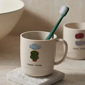 Beige plastic toothbrush mug with cute print, minimalist bathroom wash cup for home daily use.