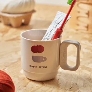 White plastic toothbrush cup with cute graphic and square handle for home bathroom wash use.