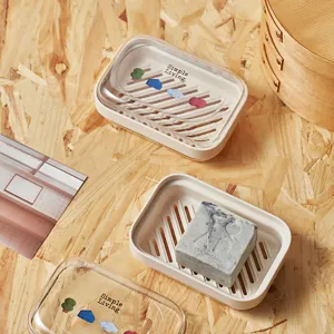 Portasapone in plastica portatile con coperchio trasparente e design di drenaggio per bagno.