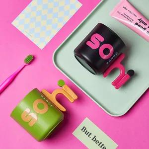 Cute creative cartoon plastic mouthwash cup with unique handle for kids and home use.