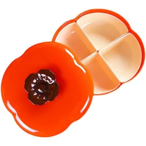 Plato de fruta dividido en forma de caqui con tapa, caja de aperitivos naranja para el salon.