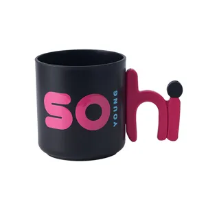 Creative black mouthwash cup with unique letter handle design for daily home bathroom use.