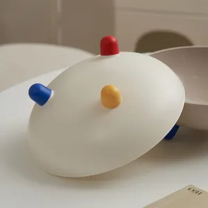 Piatto di frutta creativo minimalista moderno con piedi carini colorati per arredare il soggiorno