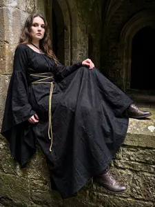 Medieval black witch dress detail view showing long sleeves and waist rope belt design.