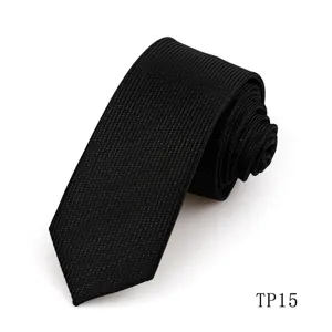 Black business necktie detail shot, premium textured polyester silk fabric with subtle glitter.