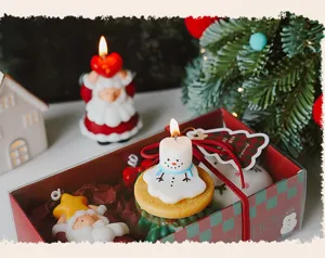 Christmas scented candle gift set with cute snowman and Santa designs for holiday decor.