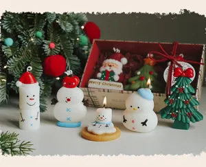 Christmas scented candle set detail showing cute snowman and tree candle designs for holiday gift.