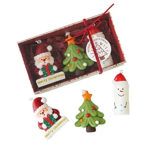 Christmas scented candle gift set with cute Santa and tree shapes for holiday home decor.