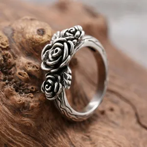 Vintage silver rose ring with detailed vine band, elegant antique style jewelry for women.