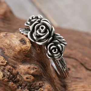 Detailed view of vintage silver rose ring with textured twig band for women and girls.
