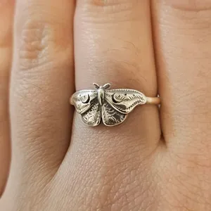 Vintage style silver moth ring featuring detailed irregular butterfly wing design for women.